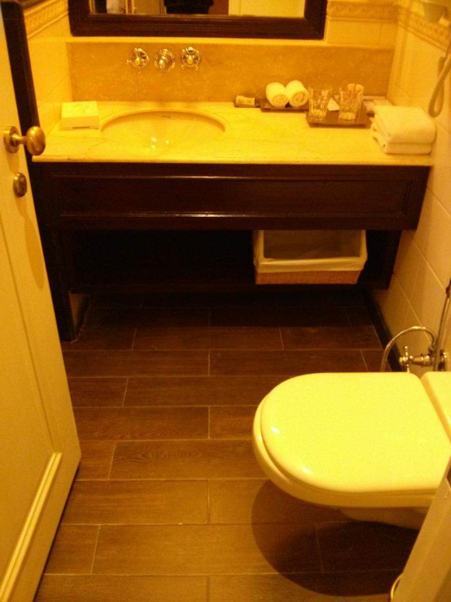a bathroom with a sink and a toilet at Welcomhotel by ITC Hotels, The Savoy, Mussoorie in Mussoorie