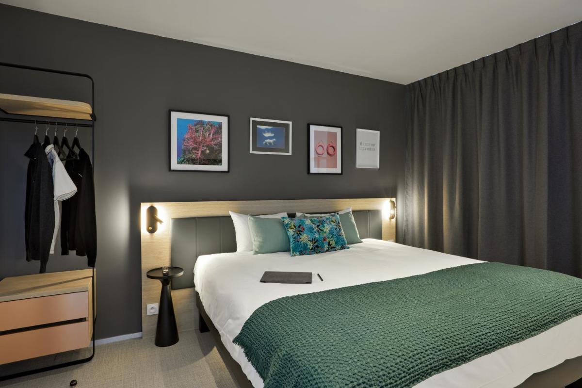 Un ou plusieurs lits dans un hébergement de l'établissement Aparthotel & Spa Adagio Vannes