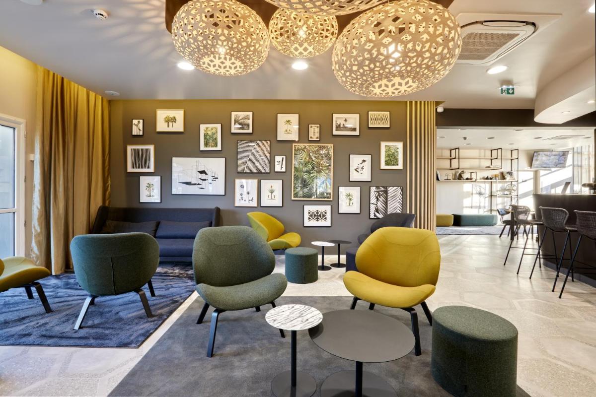 Coin salon dans l'établissement Aparthotel & Spa Adagio Vannes