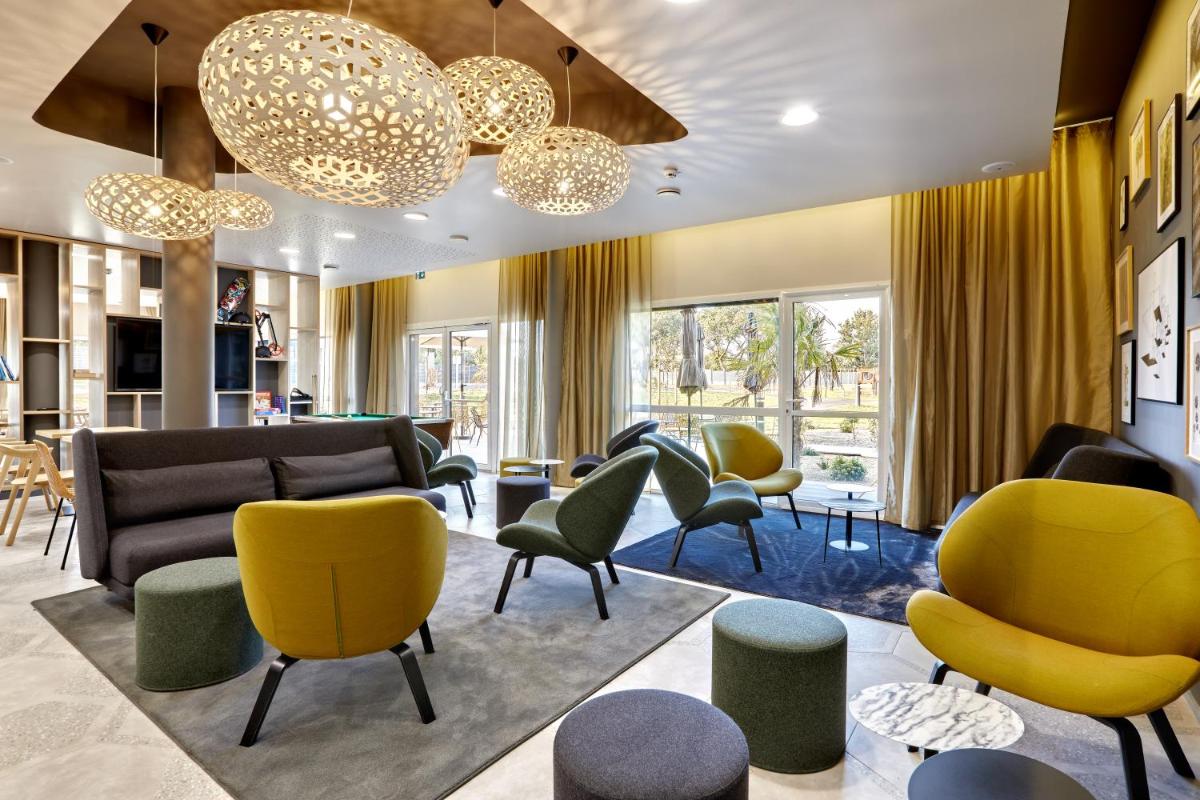 Coin salon dans l'établissement Aparthotel & Spa Adagio Vannes
