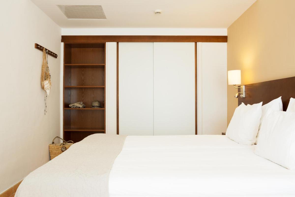 Cama o camas de una habitación en Sunprime Atlantic View Suite & Spa