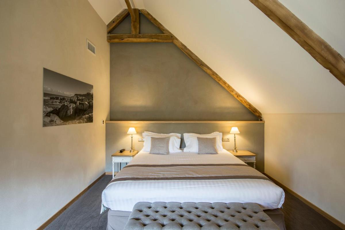 Un ou plusieurs lits dans un hébergement de l'établissement Hotel de L'Abbaye Le Tronchet - Handwritten Collection