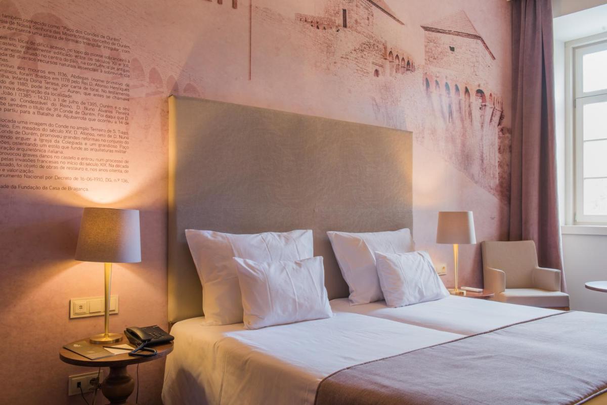 Uma cama ou camas num quarto em Vila Gale Collection Elvas