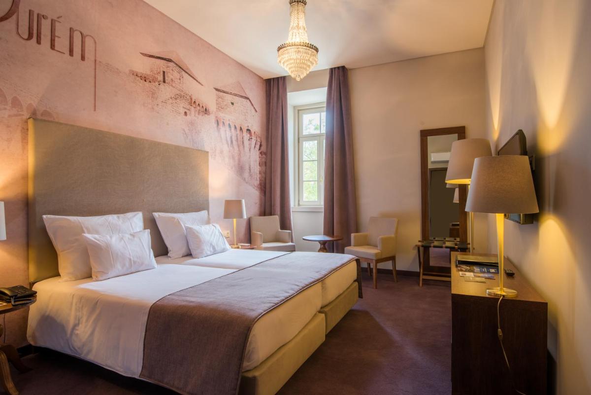 Uma cama ou camas num quarto em Vila Gale Collection Elvas