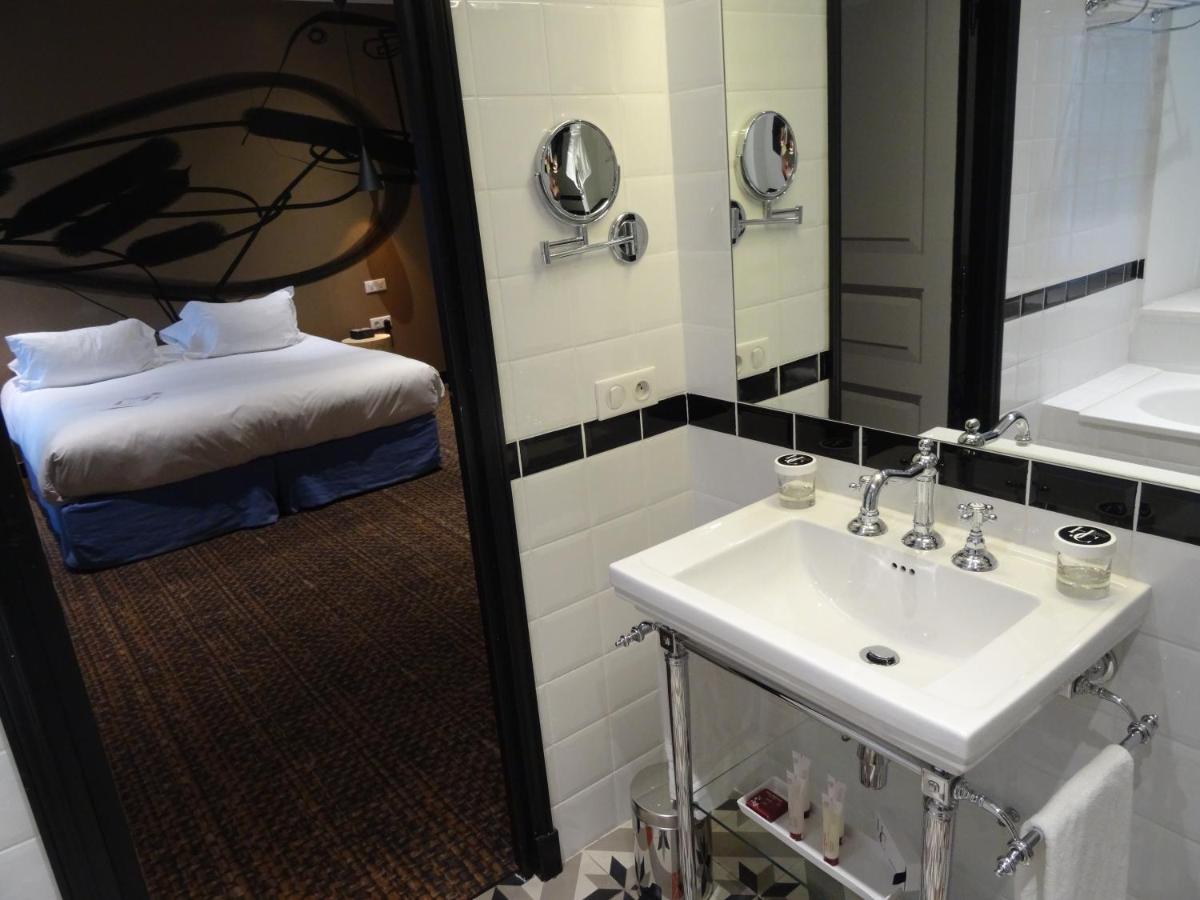 Un ou plusieurs lits dans un hébergement de l'établissement Jules César Hotel & Spa Arles - MGallery Collection