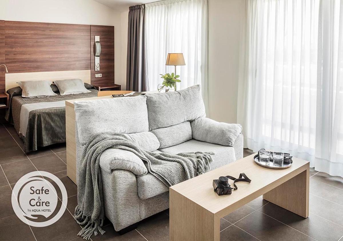 Cama o camas de una habitación en AQUA Hotel Aquamarina & Spa