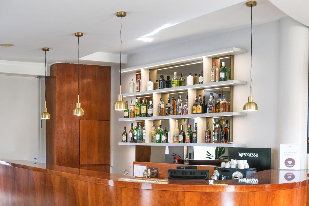 A área de bar ou lounge em Hotel Vouga