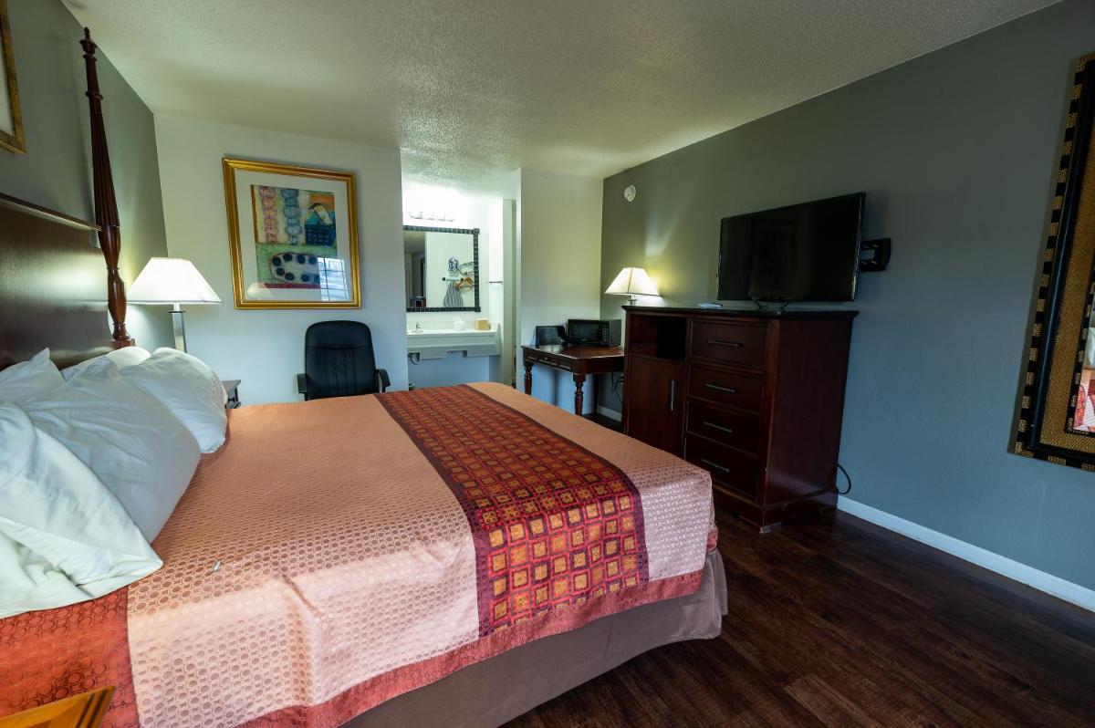 American Inn & Suites Russellville - Housity