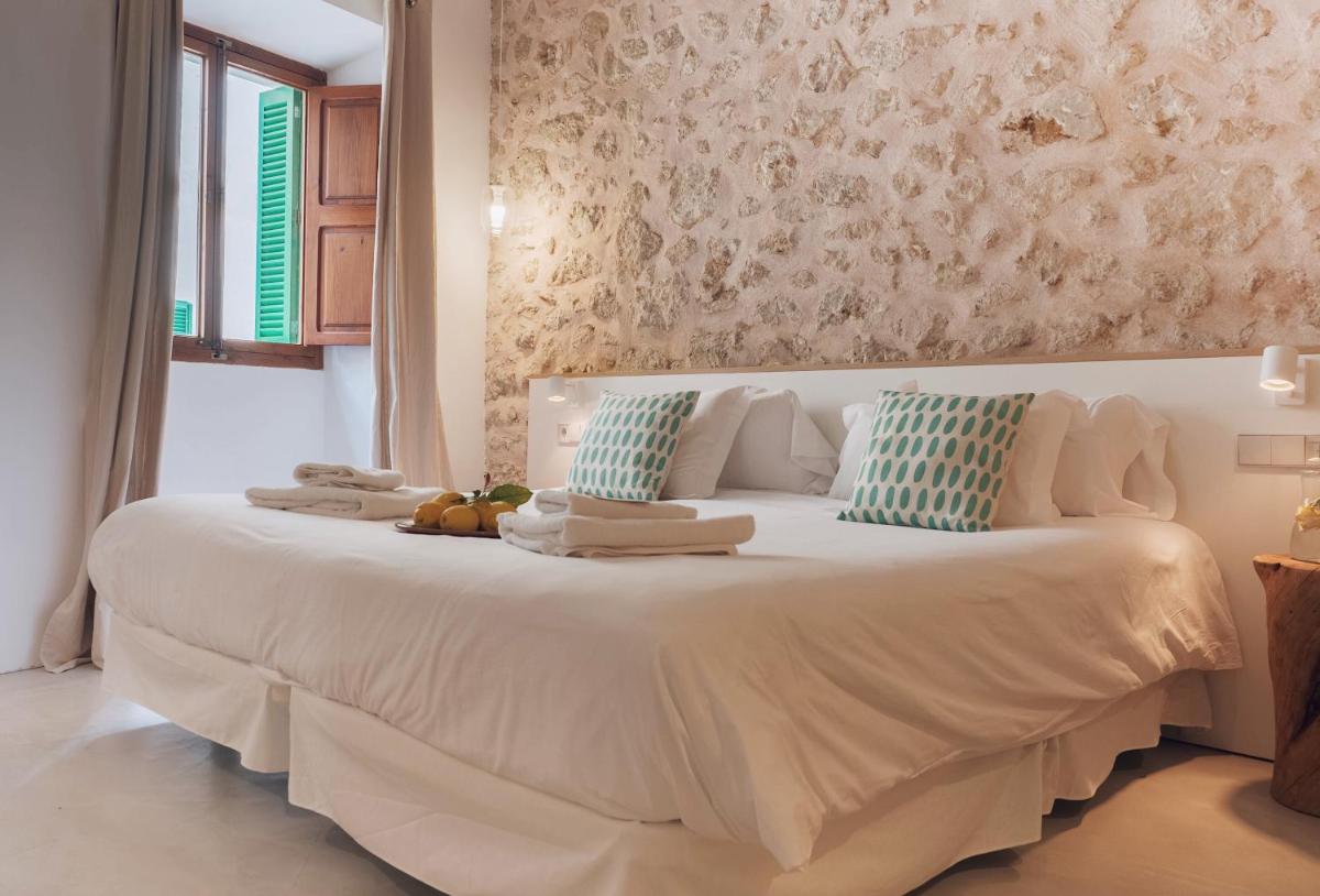 Cama o camas de una habitación en Can Cota Boutique - Turismo de interior