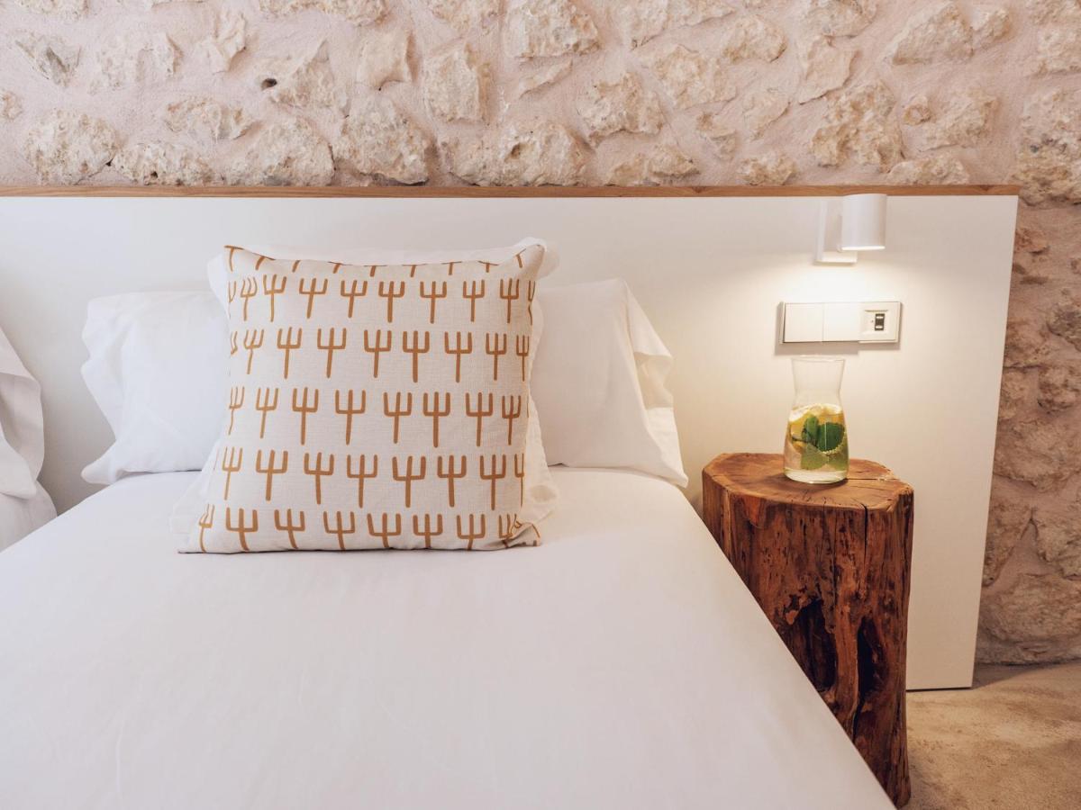 Cama o camas de una habitación en Can Cota Boutique - Turismo de interior