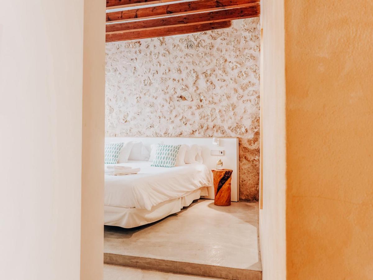 Cama o camas de una habitación en Can Cota Boutique - Turismo de interior