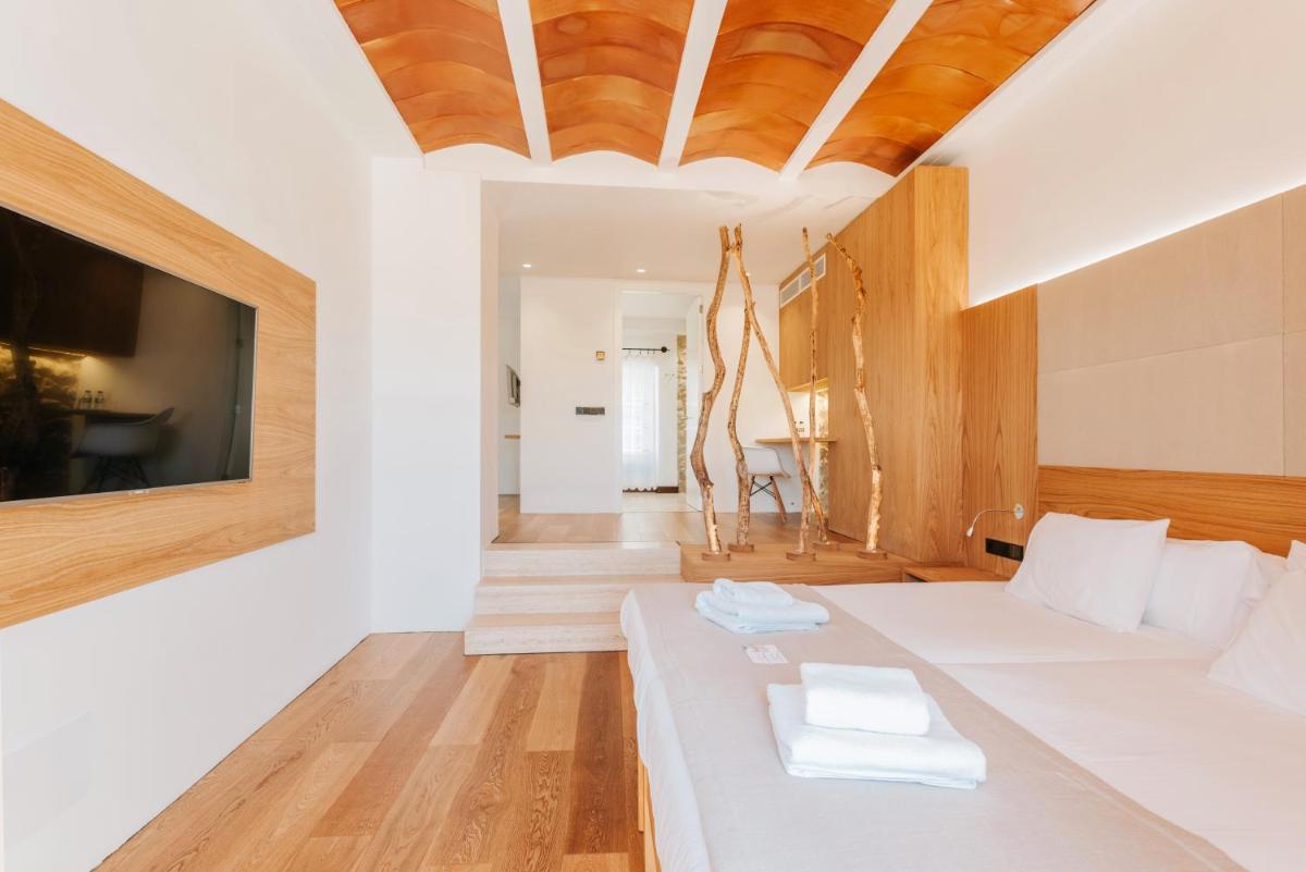 Cama o camas de una habitación en Can Cota Boutique - Turismo de interior