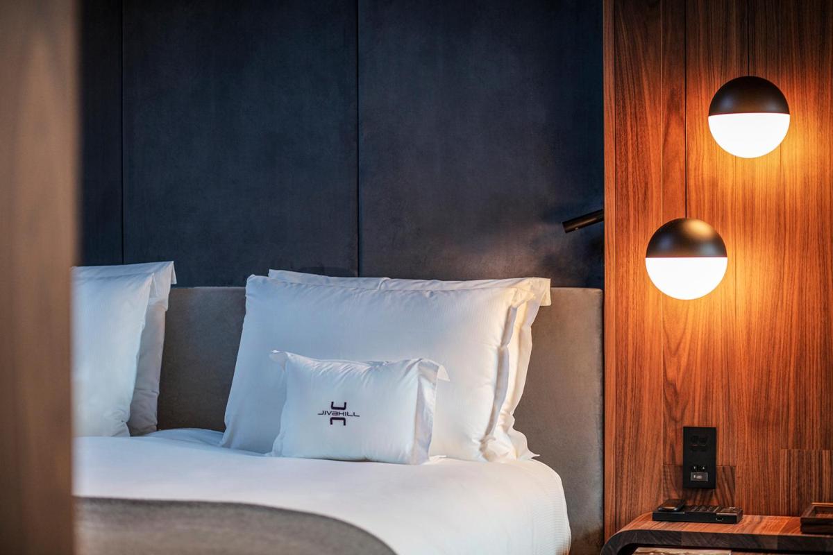 Un ou plusieurs lits dans un hébergement de l'établissement Jiva Hill Resort - Genève