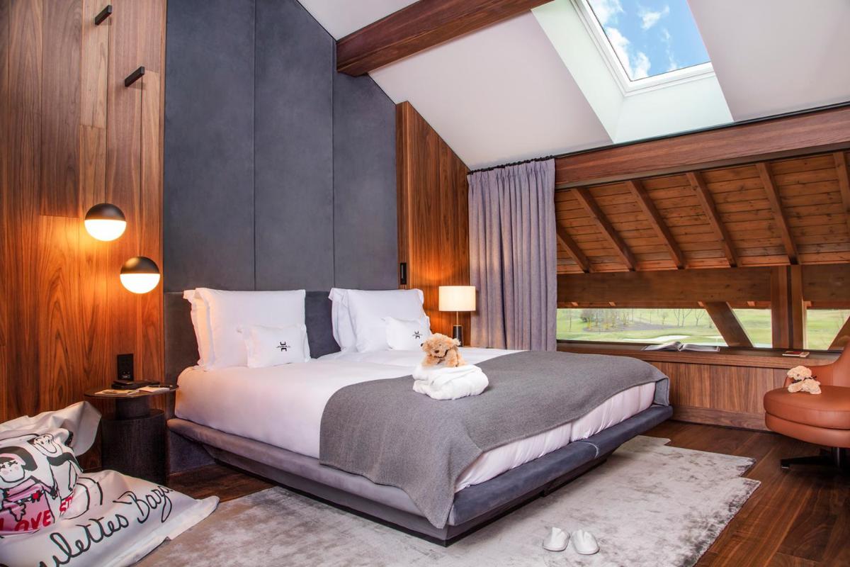 Un ou plusieurs lits dans un hébergement de l'établissement Jiva Hill Resort - Genève