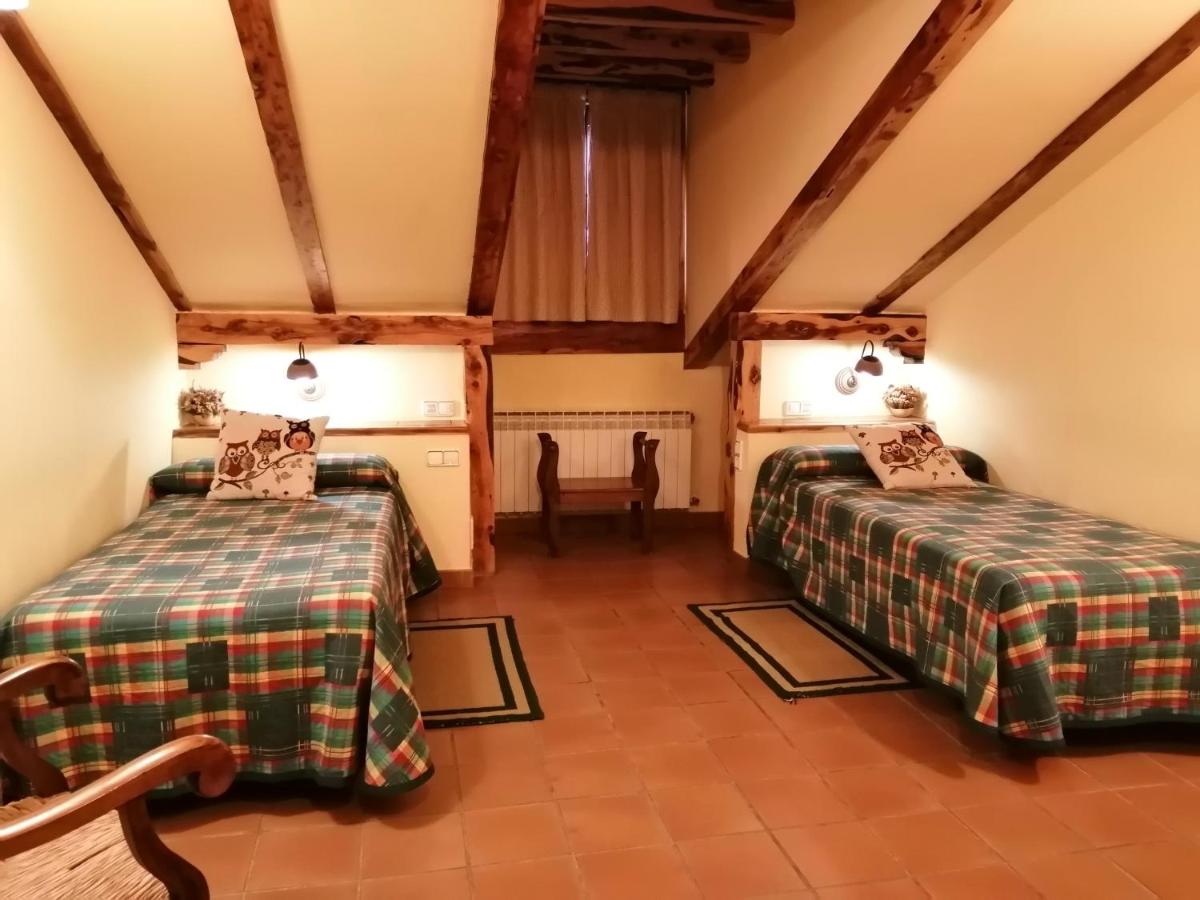 Cama o camas de una habitación en Hotel Rural & SPA Puente del Duratón