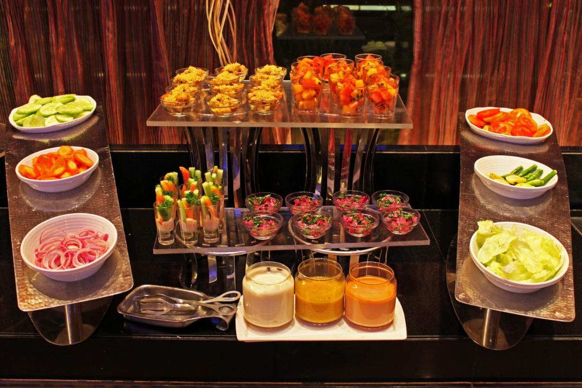 a buffet with different types of food and drinks at Fortune Select SG Highway, Ahmedabad - Member ITC Hotels' Group in Ahmedabad