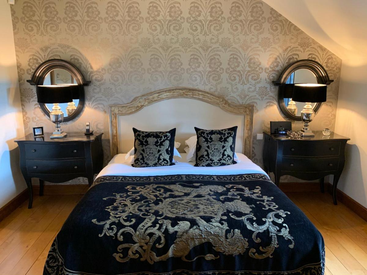 Un ou plusieurs lits dans un hébergement de l'établissement Beaumanoir Small Luxury Boutique Hotel