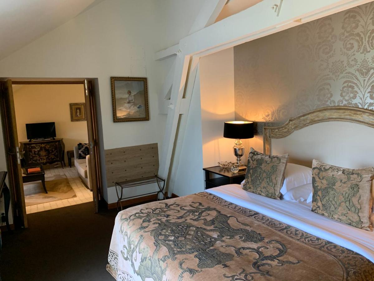 Un ou plusieurs lits dans un hébergement de l'établissement Beaumanoir Small Luxury Boutique Hotel