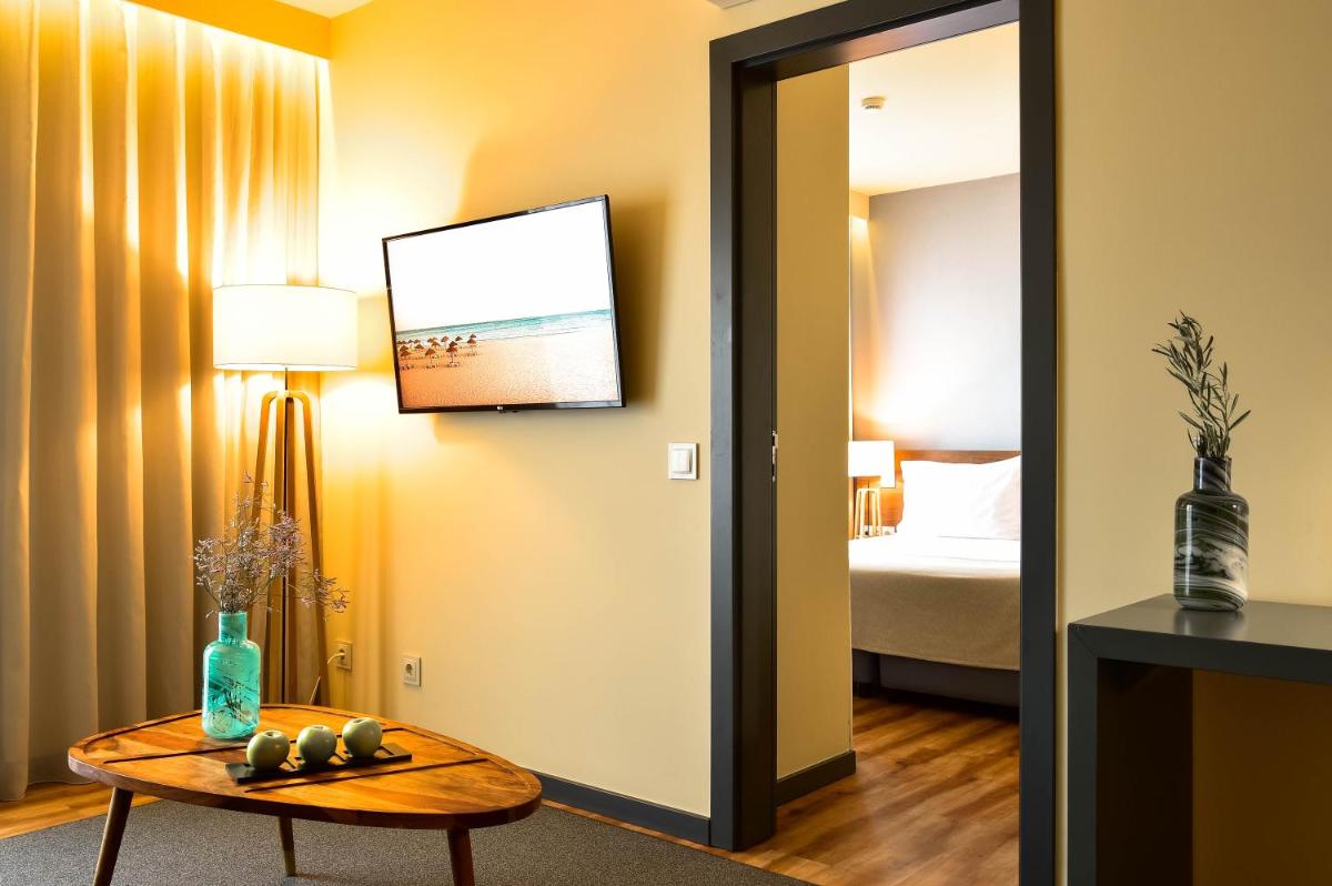 Uma televisão e/ou sistema de entretenimento em The Prime Energize Hotel & SPA - Algarve