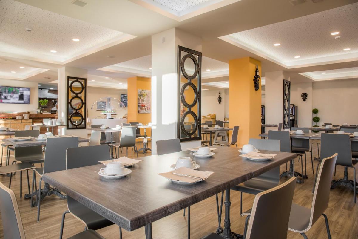 Um restaurante ou outro lugar para comer em Boavista Golf & Spa - Bela Colina Holidays
