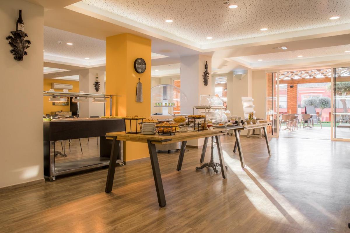 Um restaurante ou outro lugar para comer em Boavista Golf & Spa - Bela Colina Holidays