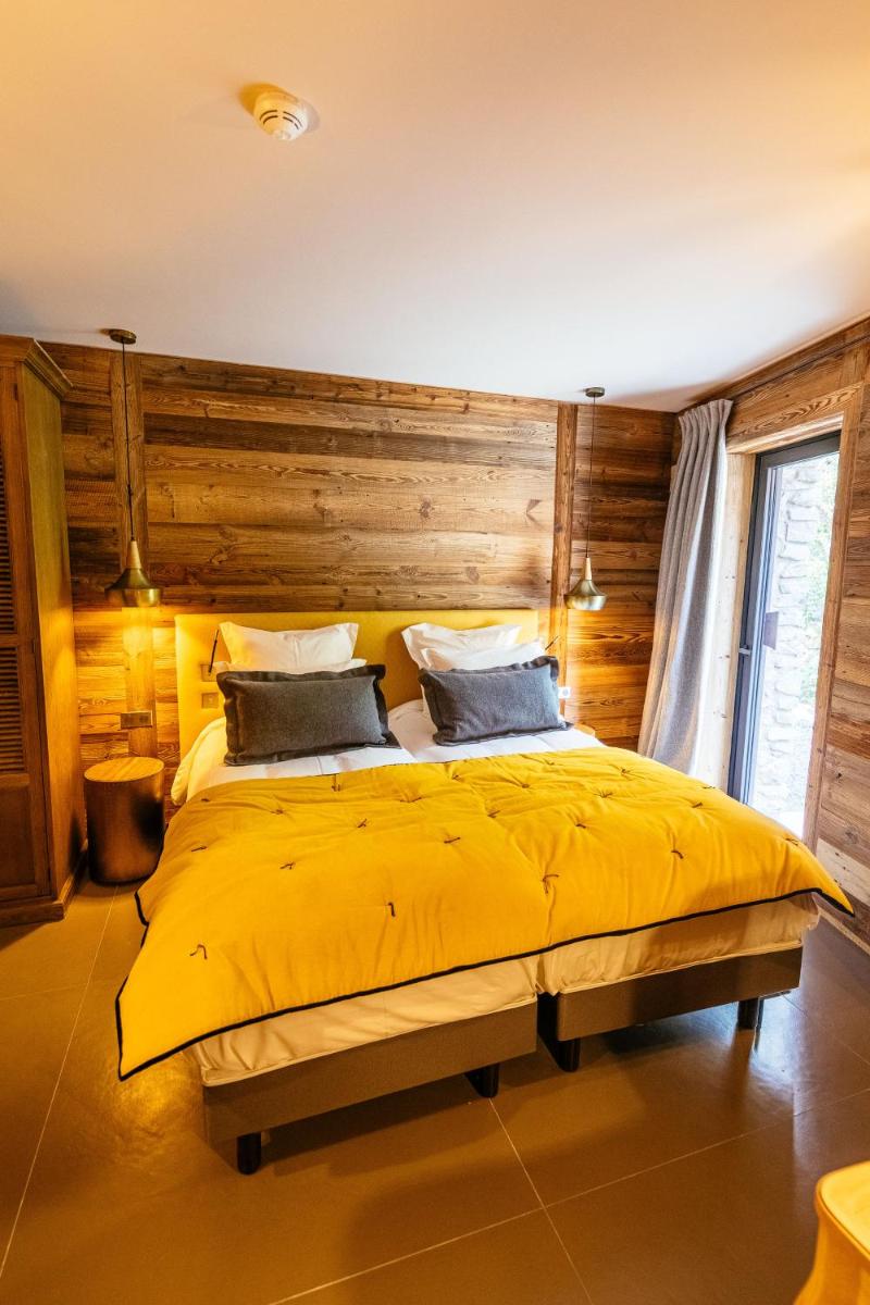 Un ou plusieurs lits dans un hébergement de l'établissement Hotel Le V de Vaujany