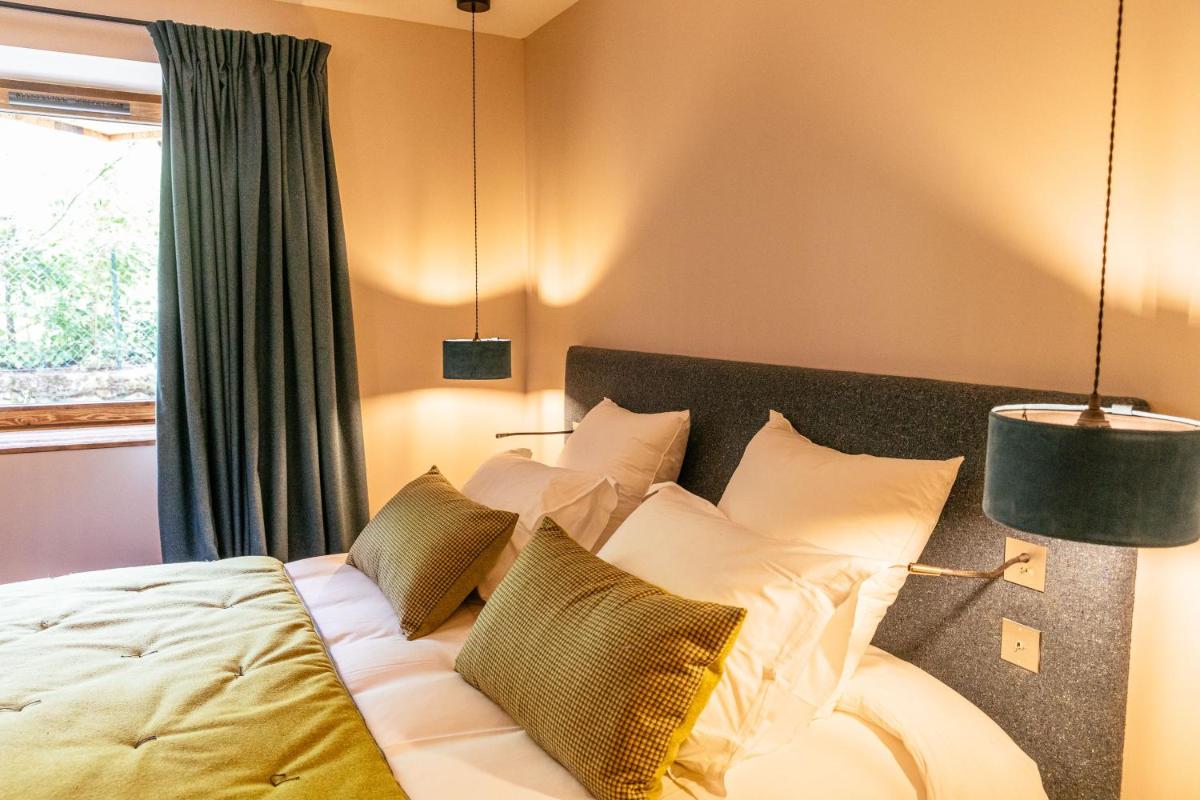Un ou plusieurs lits dans un hébergement de l'établissement Hotel Le V de Vaujany