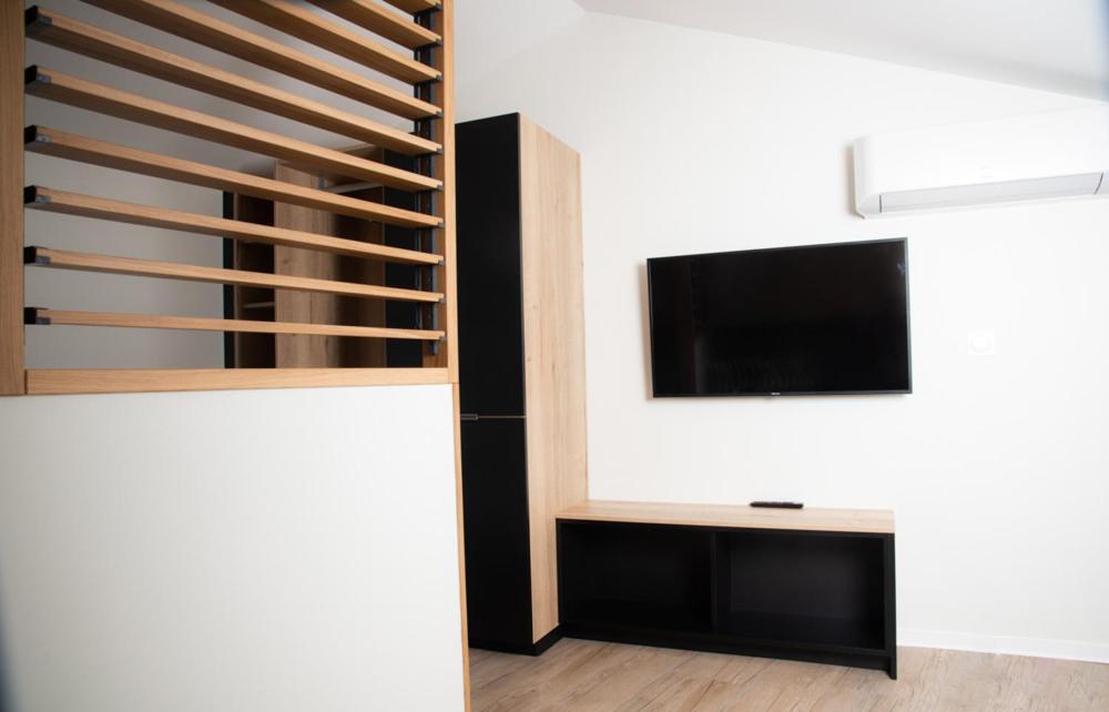 Télévision ou salle de divertissement dans l'établissement Hotel Les Dunes