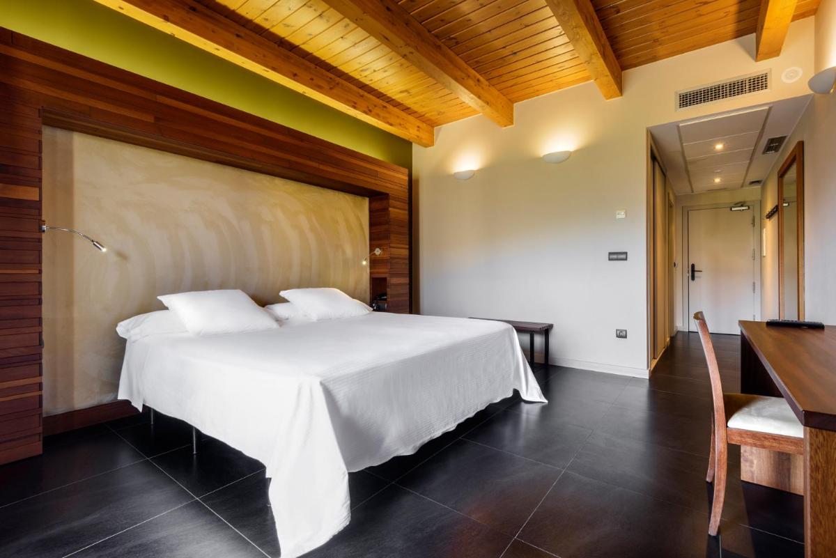 Cama o camas de una habitación en Hotel Spa Aguas de los Mallos