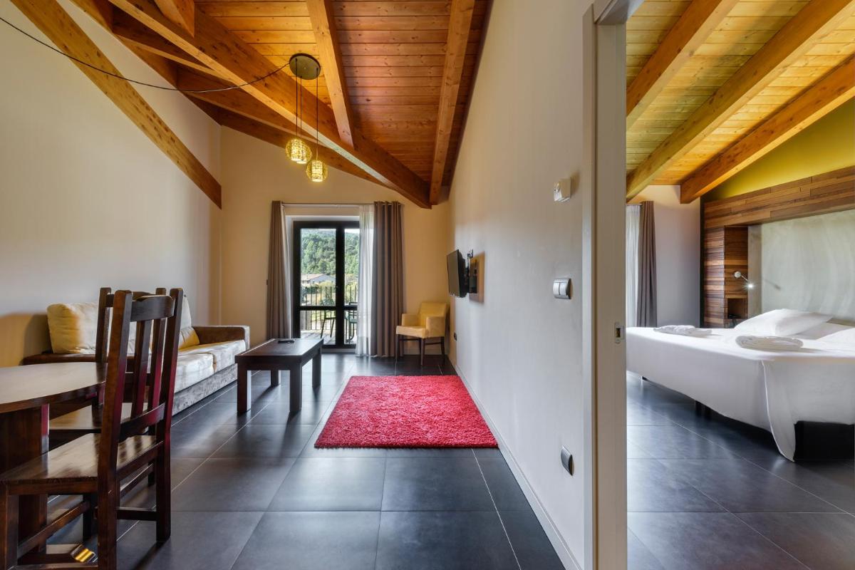 Cama o camas de una habitación en Hotel Spa Aguas de los Mallos