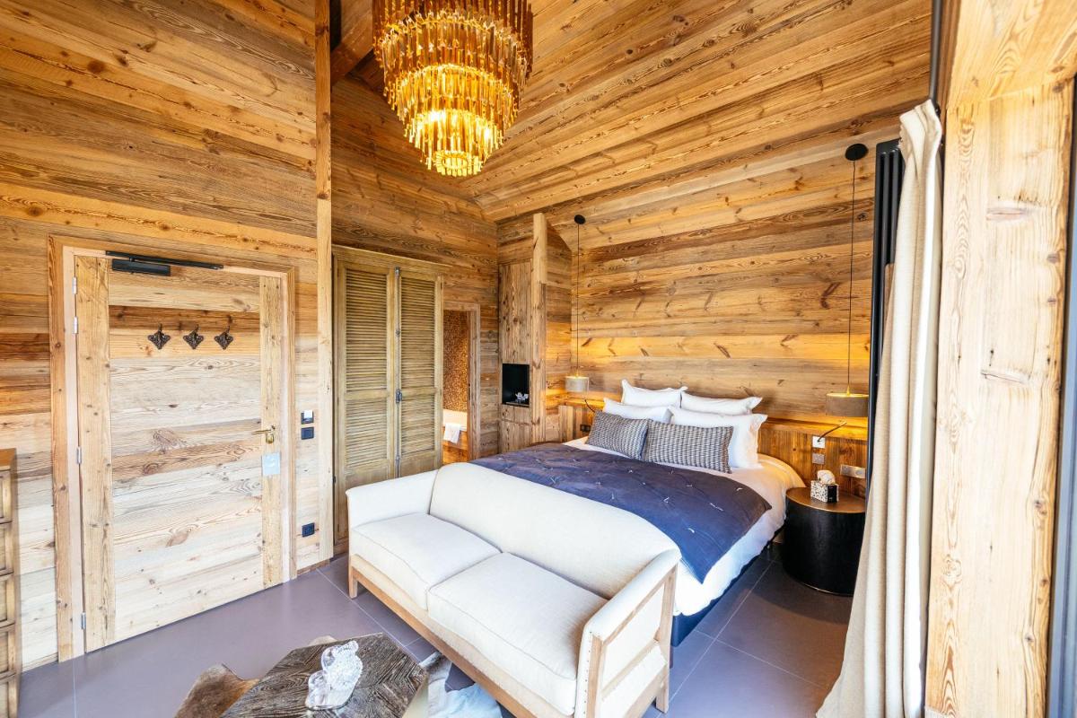 Un ou plusieurs lits dans un hébergement de l'établissement Hotel Le V de Vaujany