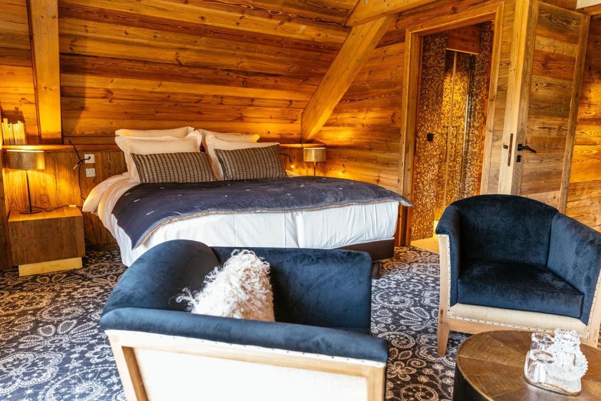Coin salon dans l'établissement Hotel Le V de Vaujany