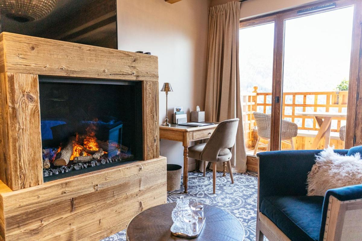 Coin salon dans l'établissement Hotel Le V de Vaujany