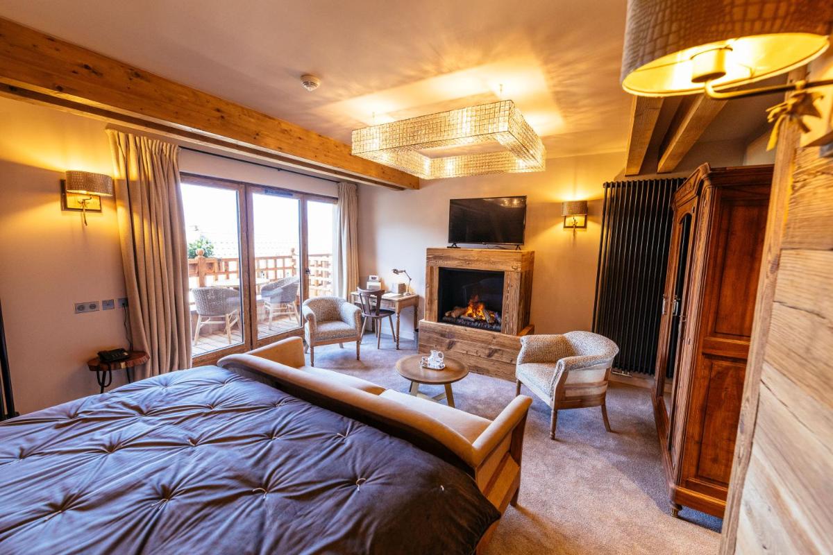 Télévision ou salle de divertissement dans l'établissement Hotel Le V de Vaujany