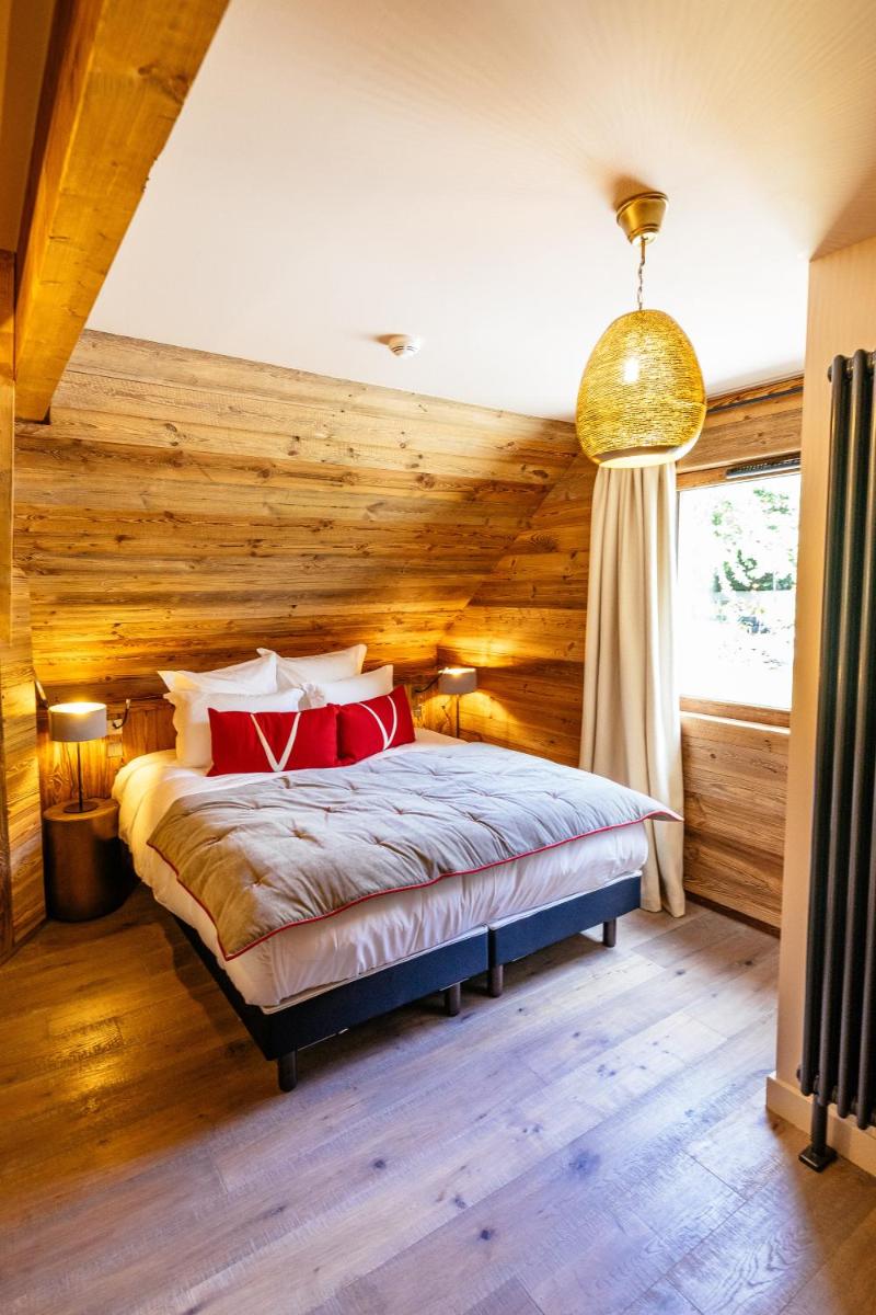 Un ou plusieurs lits dans un hébergement de l'établissement Hotel Le V de Vaujany