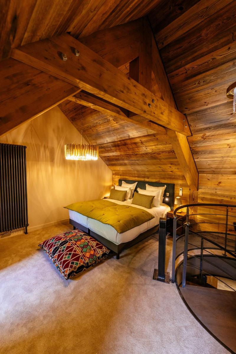 Un ou plusieurs lits dans un hébergement de l'établissement Hotel Le V de Vaujany
