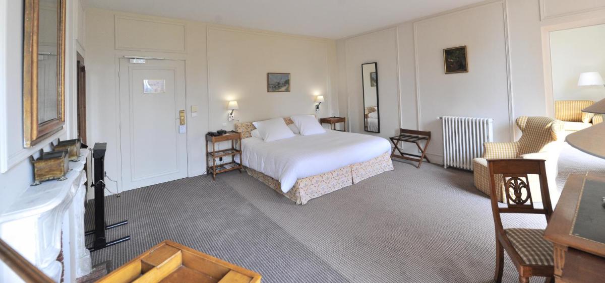 Un ou plusieurs lits dans un hébergement de l'établissement Hôtel Villa Navarre