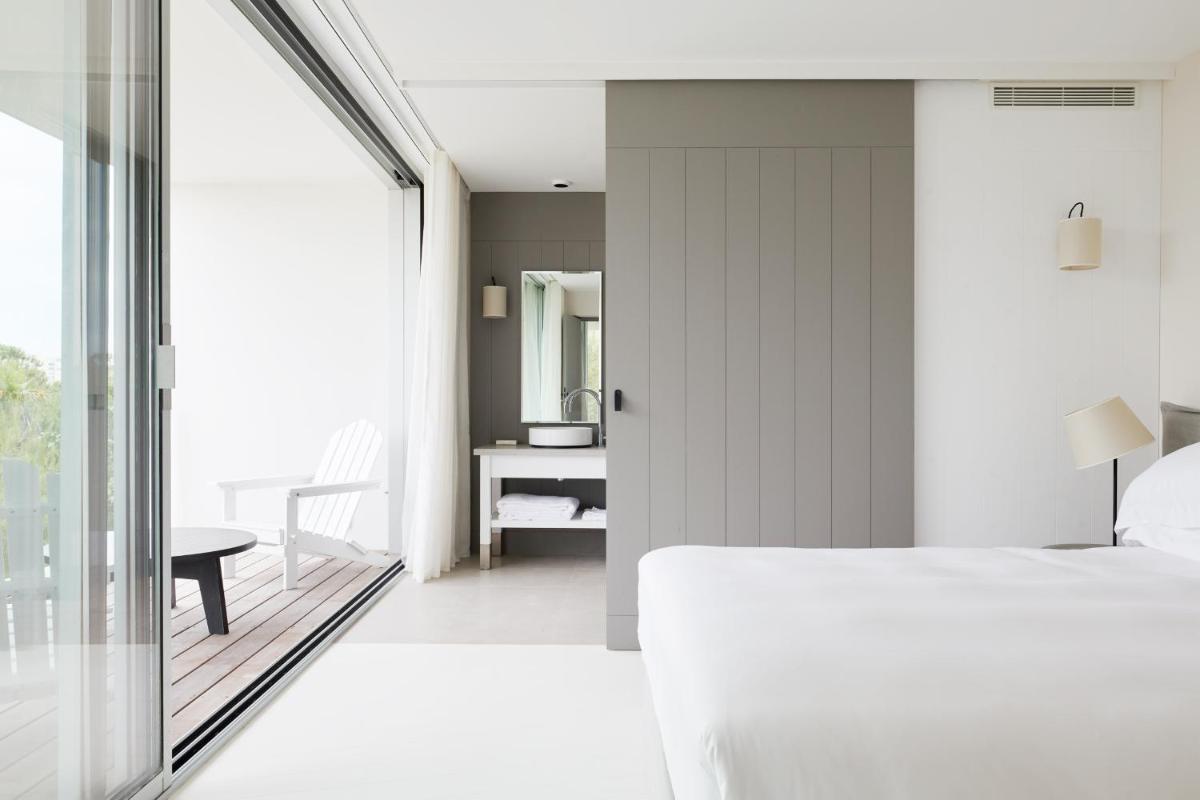 Un ou plusieurs lits dans un hébergement de l'établissement Hôtel Plage Palace & Spa
