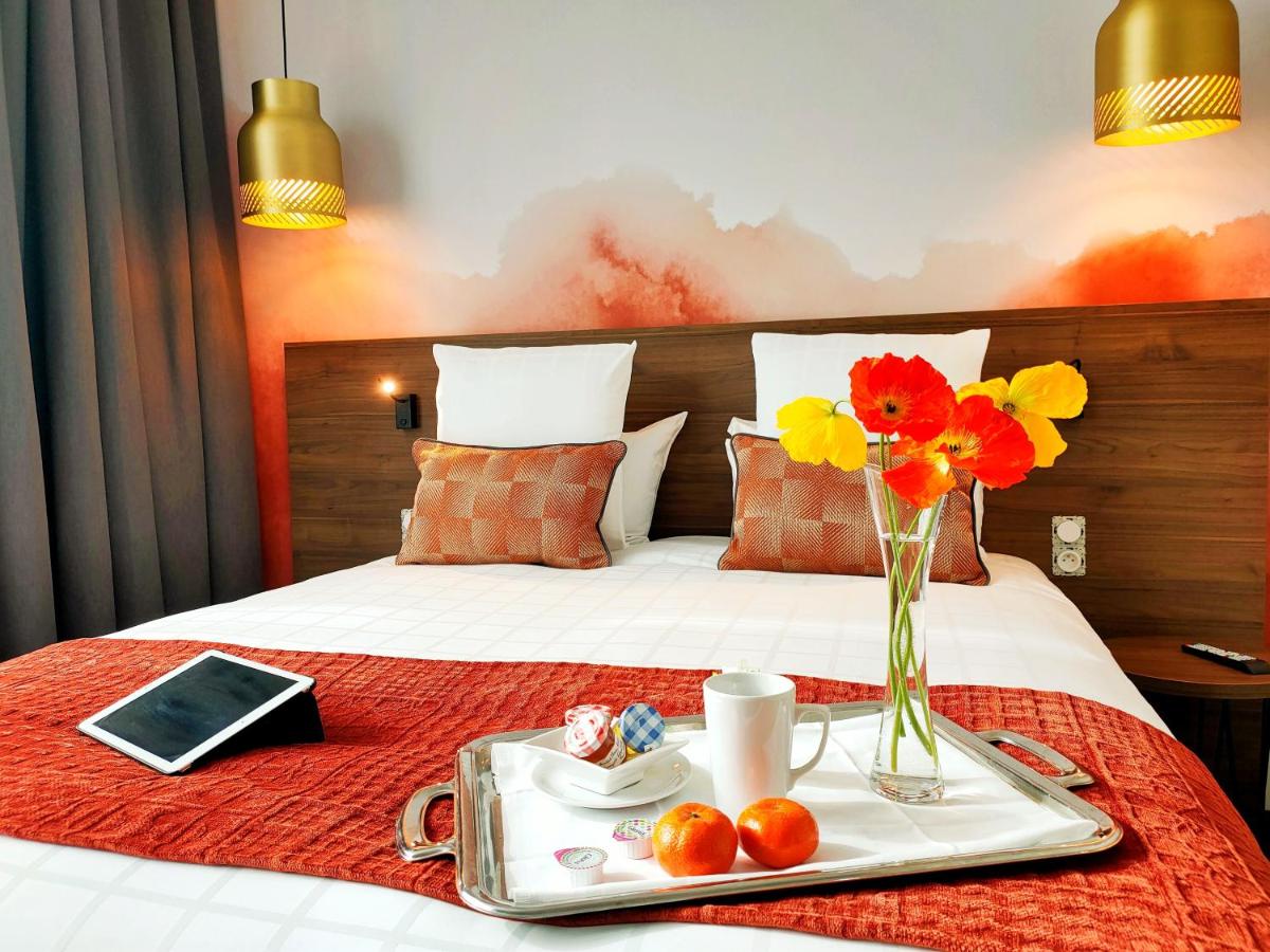 Un ou plusieurs lits dans un hébergement de l'établissement Abbaye des Capucins Spa & Resort