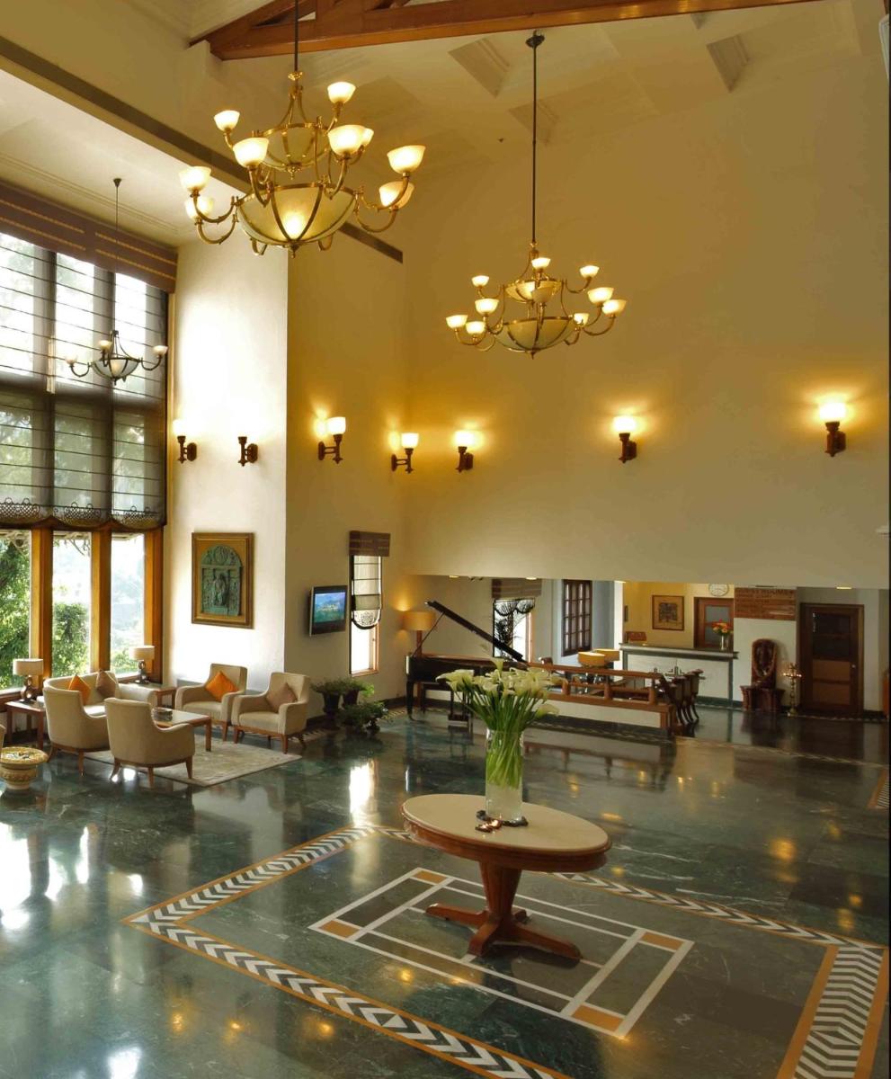 a large room with a lobby with chairs and a table at Jaypee Residency Manor in Mussoorie