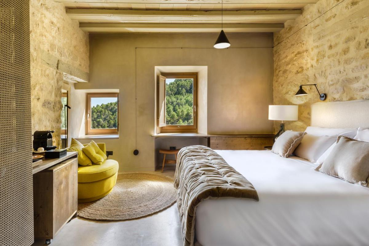 Cama o camas de una habitación en Torre del Marqués Hotel Spa & Winery - Small Luxury Hotels