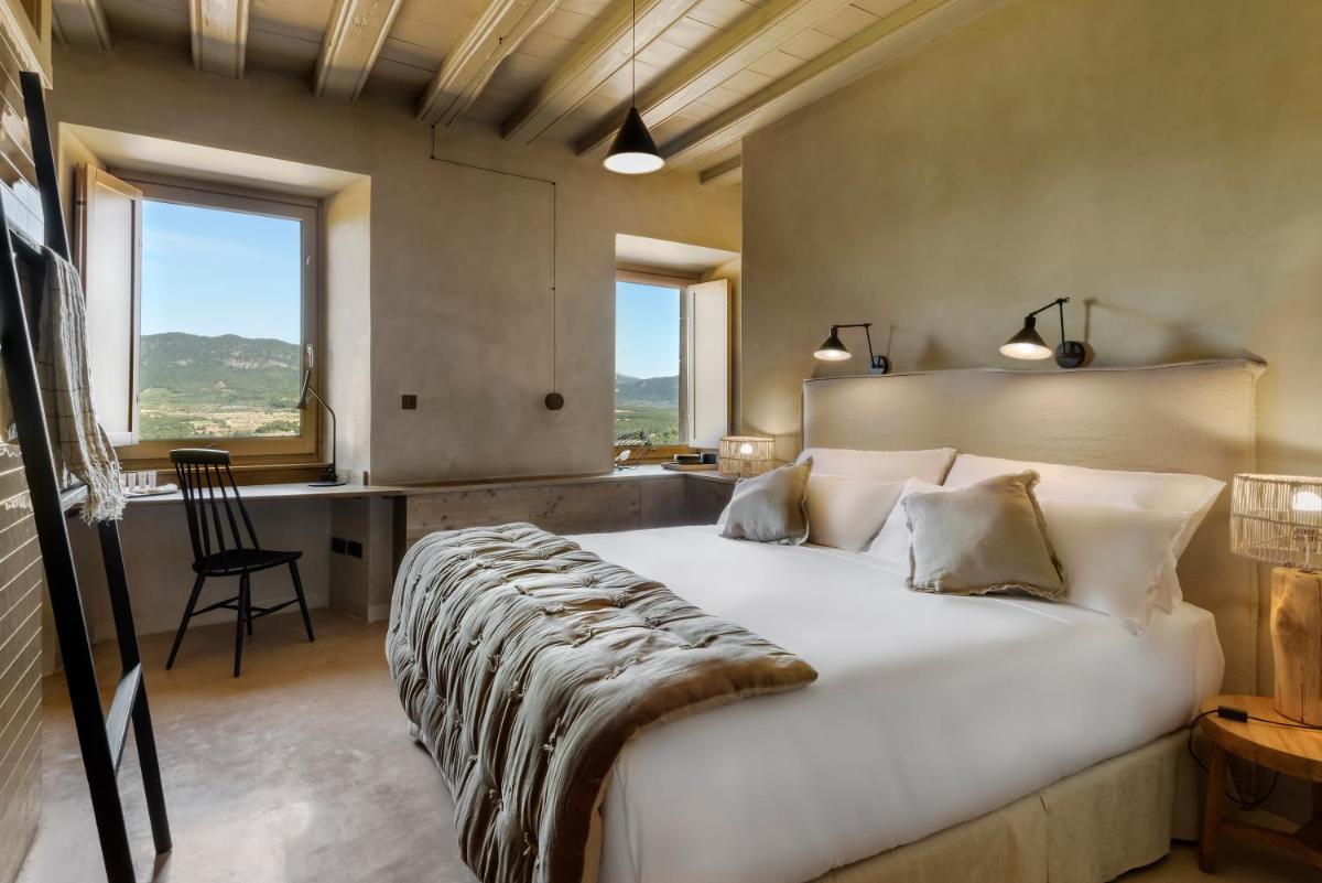 Cama o camas de una habitación en Torre del Marqués Hotel Spa & Winery - Small Luxury Hotels