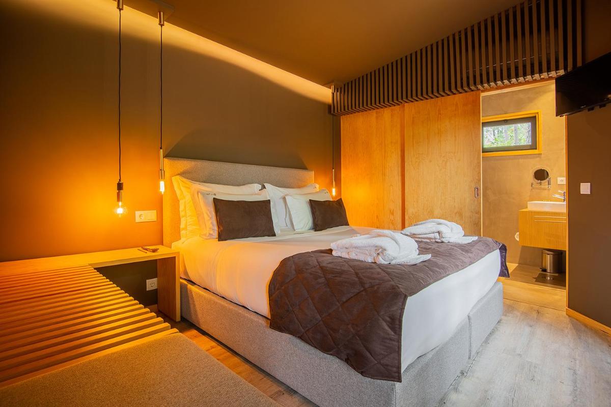 Uma cama ou camas num quarto em Quinta do Pedregal Hotel & Spa