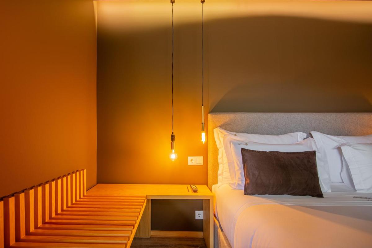 Uma cama ou camas num quarto em Quinta do Pedregal Hotel & Spa