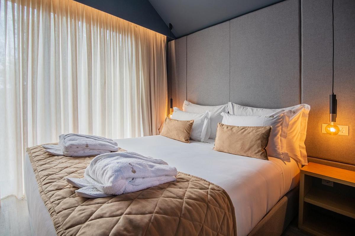Uma cama ou camas num quarto em Quinta do Pedregal Hotel & Spa