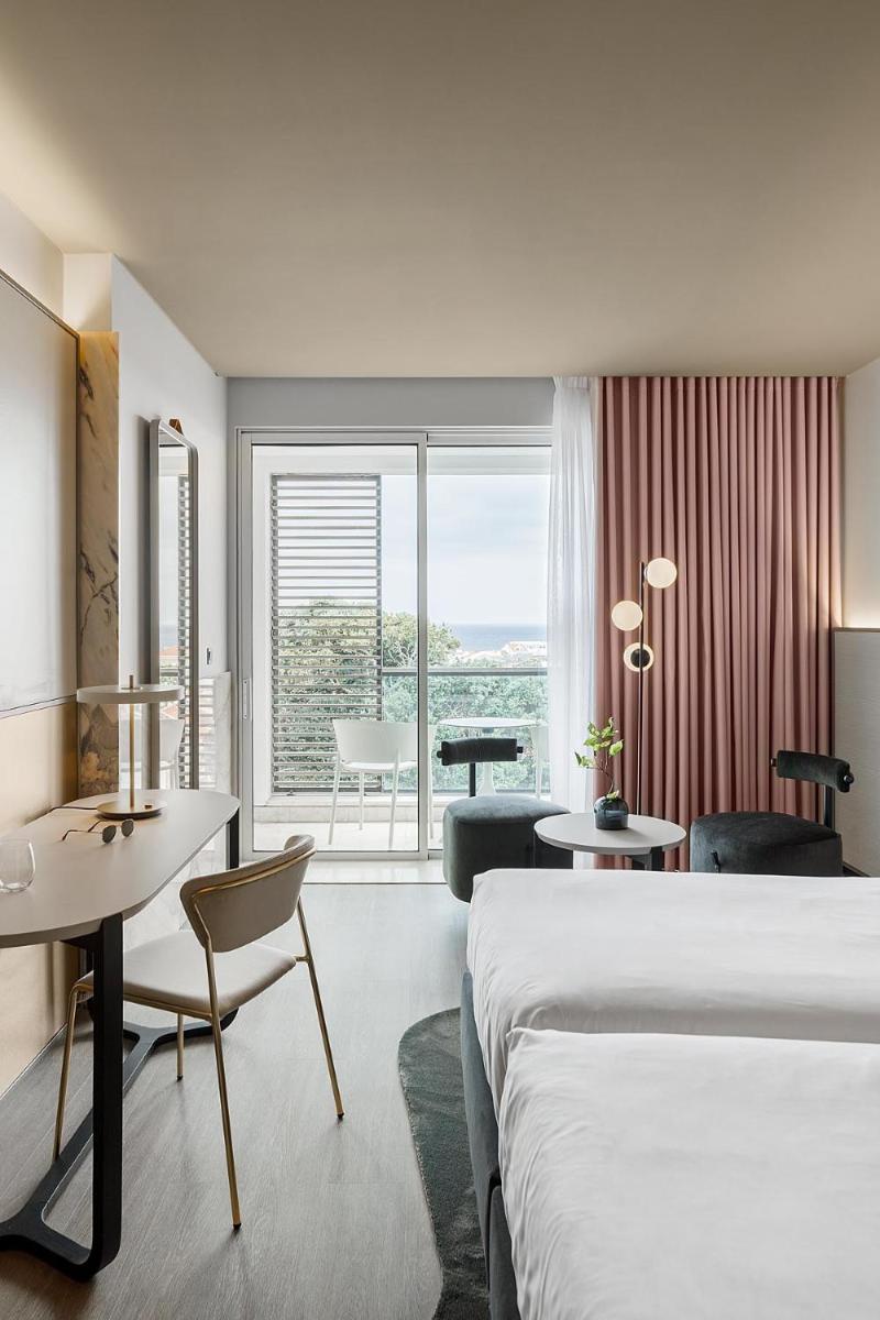 Uma cama ou camas num quarto em Azoris Royal Garden – Leisure & Conference Hotel