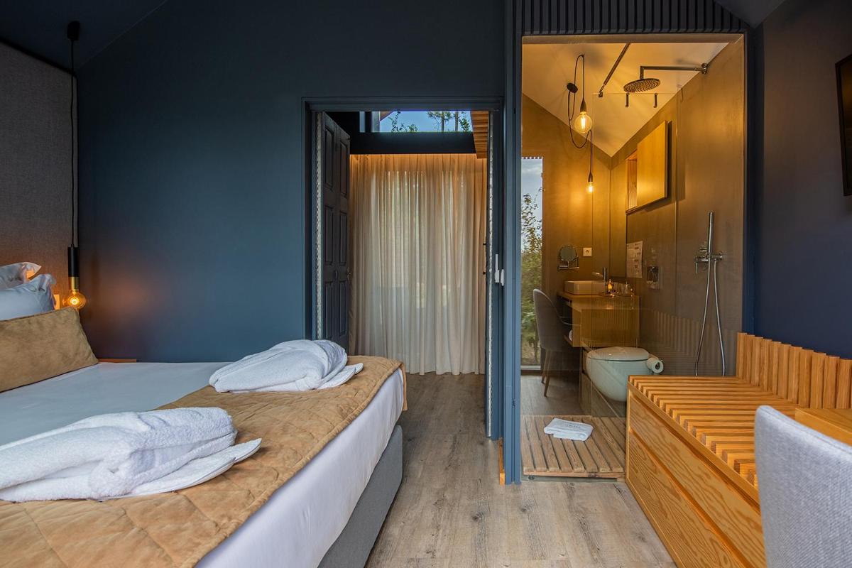 Uma cama ou camas num quarto em Quinta do Pedregal Hotel & Spa