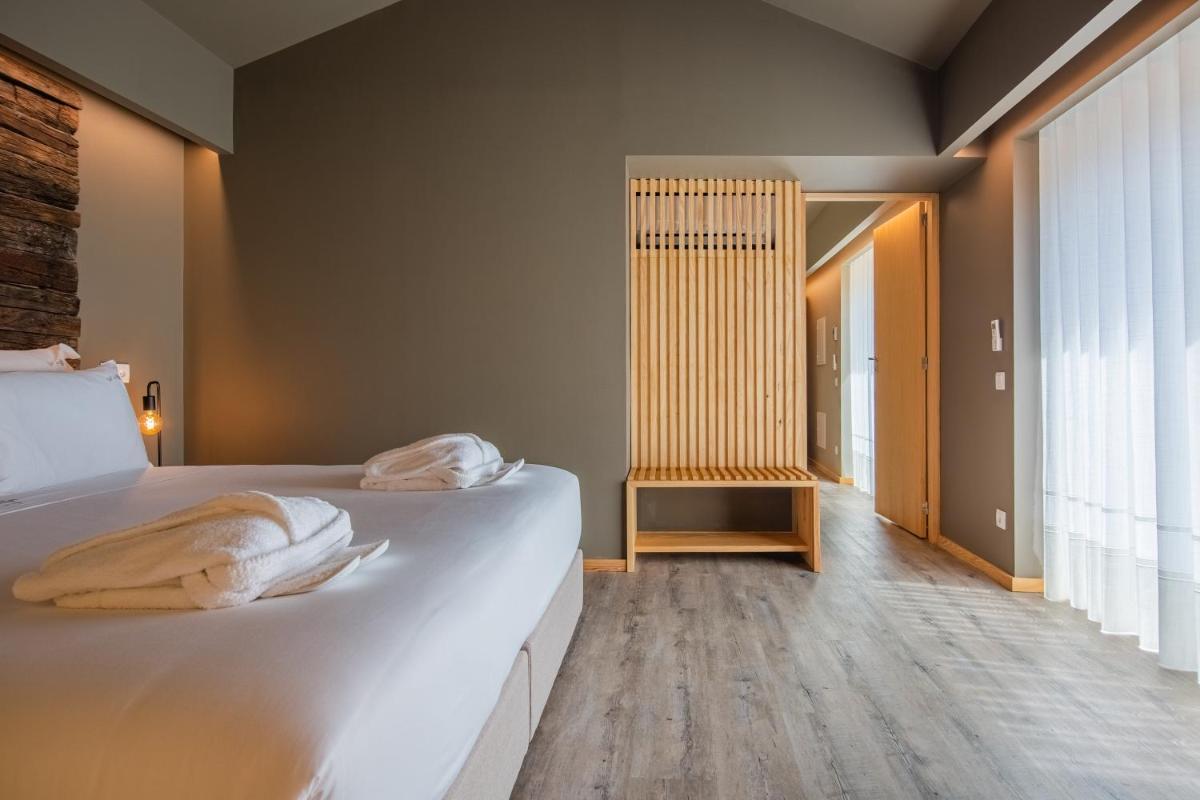 Uma cama ou camas num quarto em Quinta do Pedregal Hotel & Spa