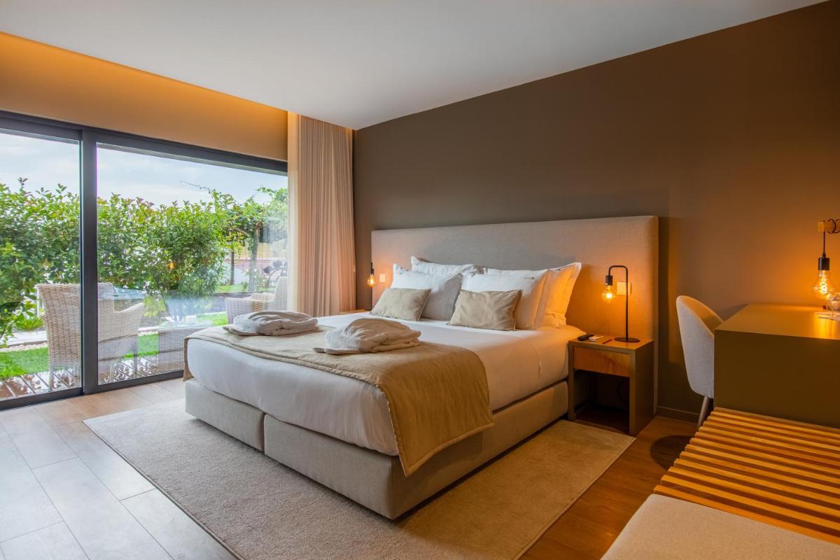 Uma cama ou camas num quarto em Quinta do Pedregal Hotel & Spa