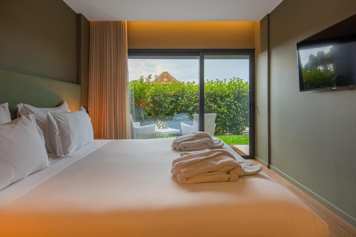 Uma cama ou camas num quarto em Quinta do Pedregal Hotel & Spa